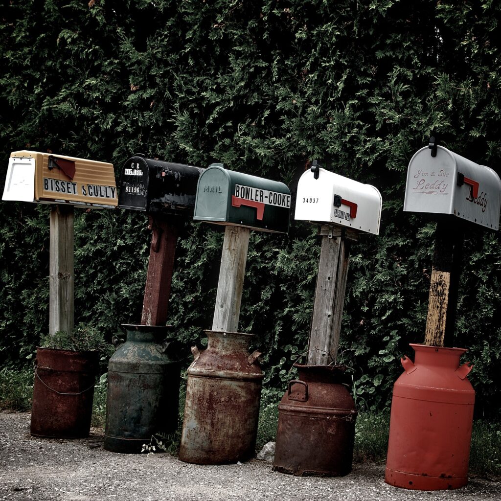 Debt validation notice illustration: a row of roadside mailboxes in Canada, not Boston