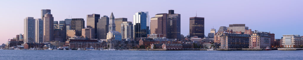 Boston waterfront skyline across the harbor.